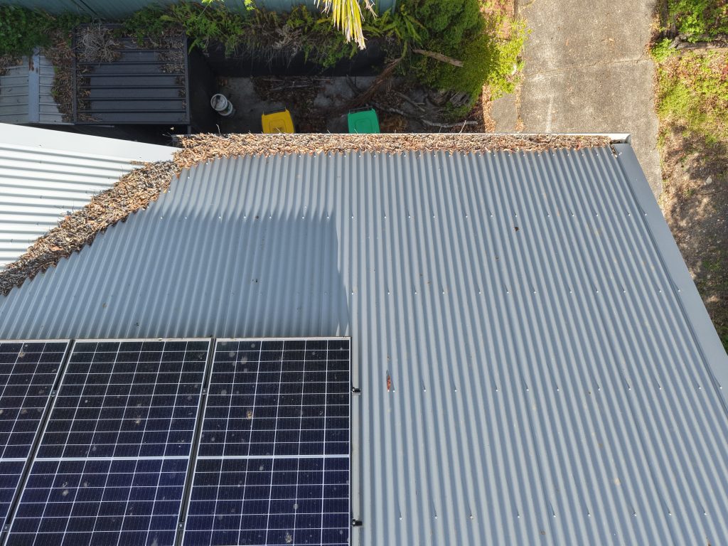Gutter packed with leaves, drone view
