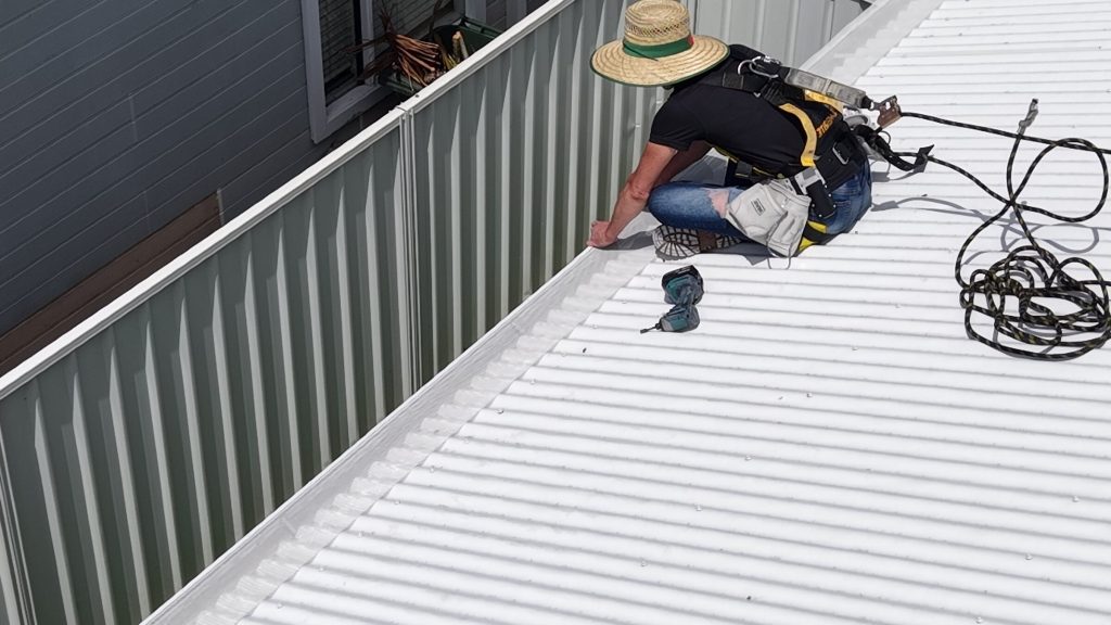 Gutter guard being installed along the roof edge of the Warilla home