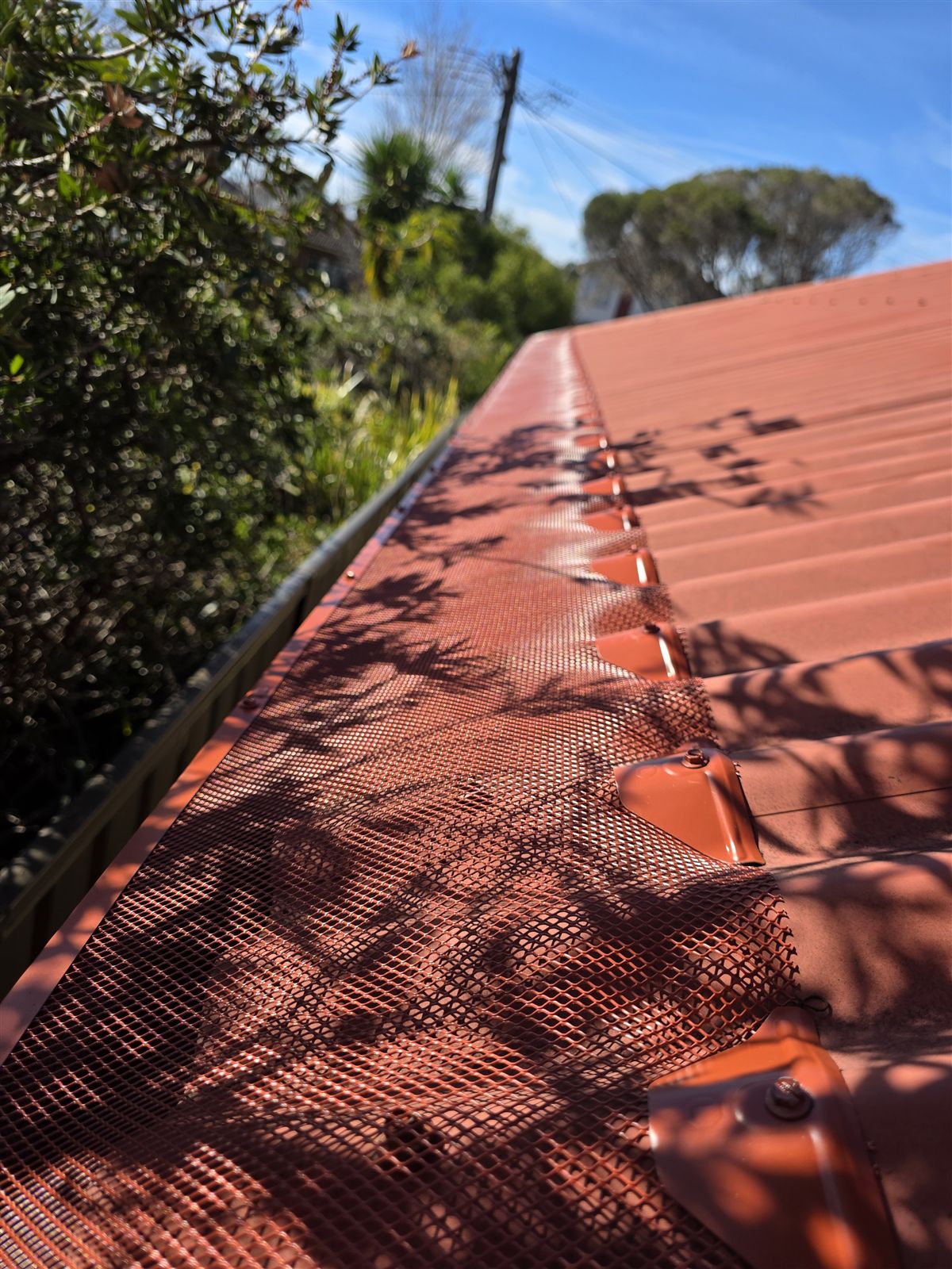 Close-up of terracotta aluminium mesh gutter guard