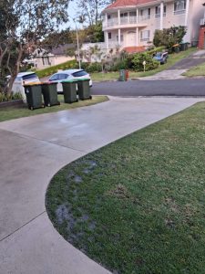 Clean concrete driveway after pressure cleaning in Mount Ousley
