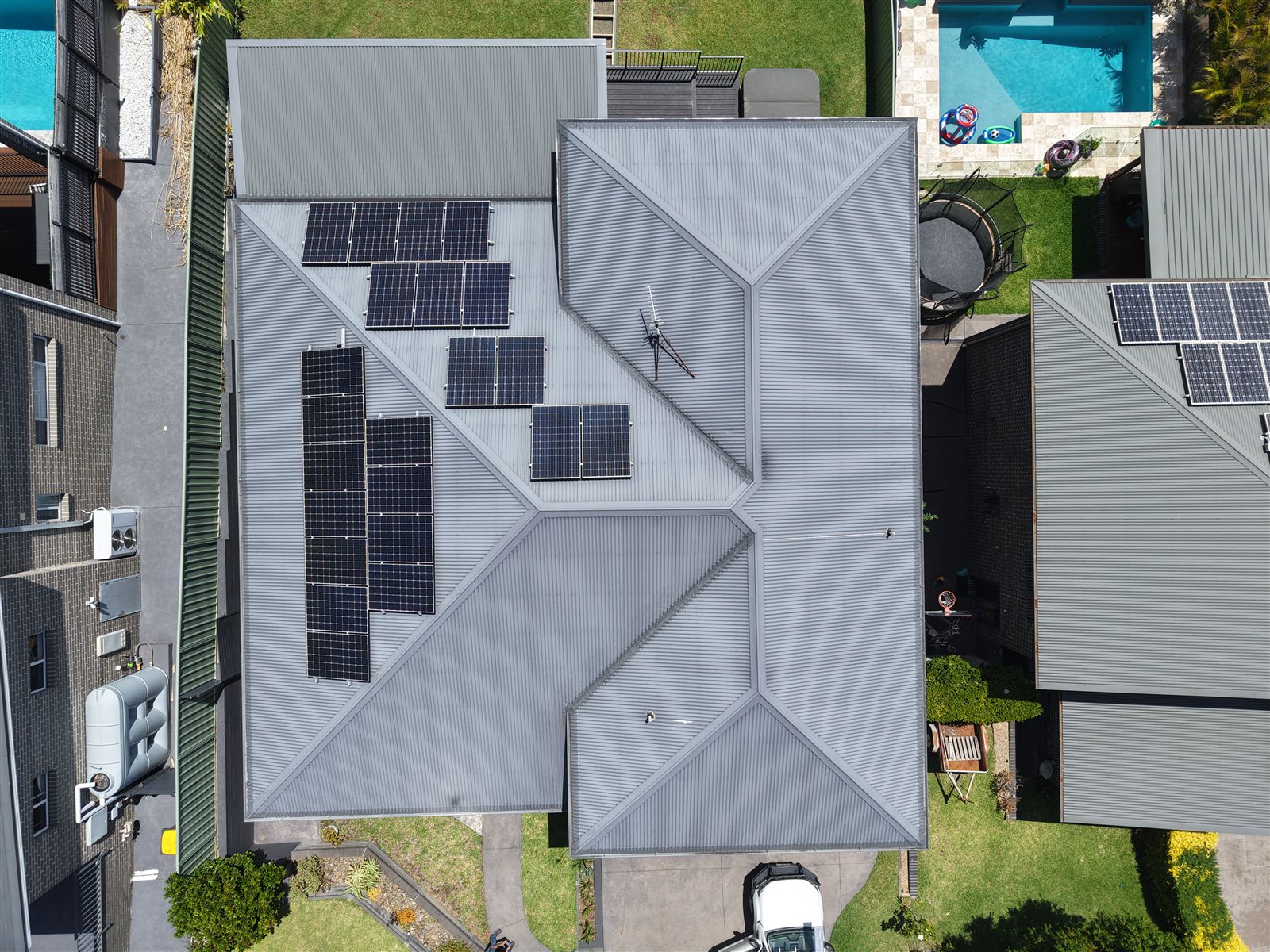 Top-down drone view of gutter guard on a Figtree home