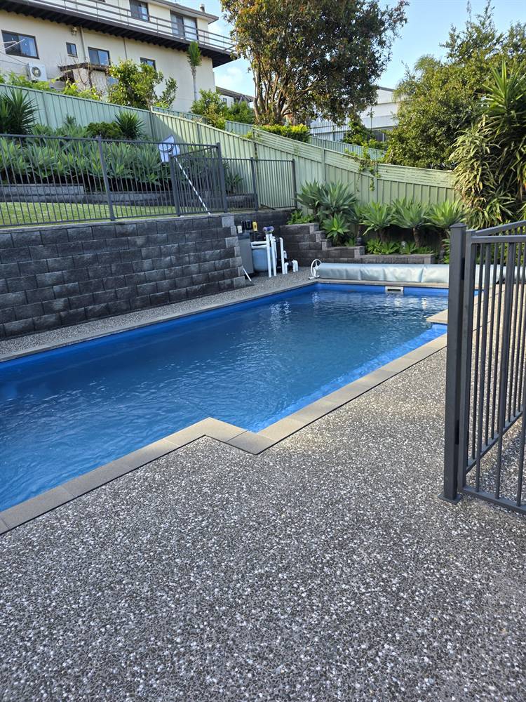 Pool deck and exposed aggregate concrete after pressure cleaning