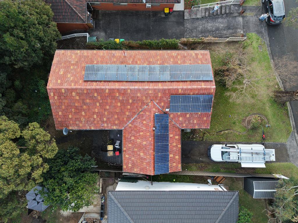 Drone view of a clean terracotta tile roof after a roof wash