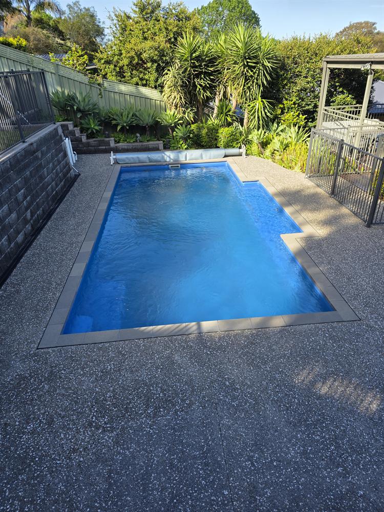 Pool surround and exposed aggregate concrete after pressure cleaning