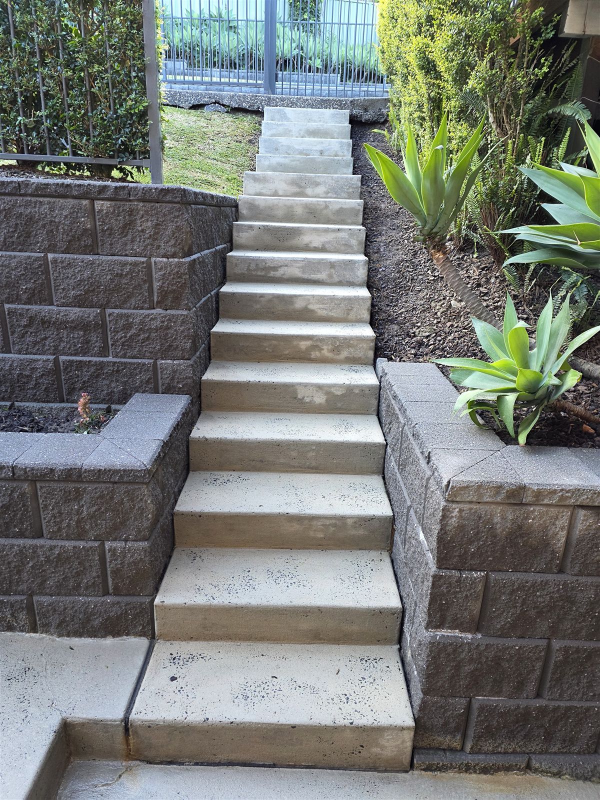 Steps and retaining walls pressure washed in Mount Ousley