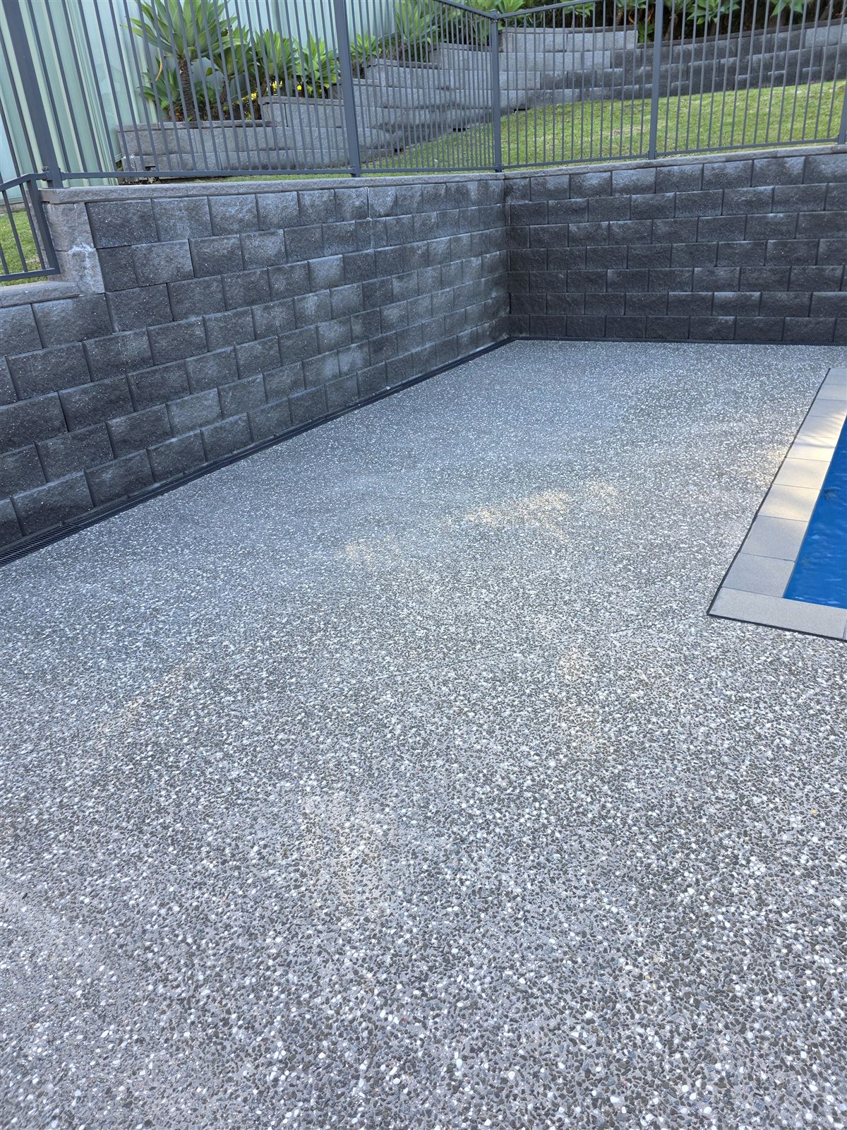 Pool surround pressure washed in Mount Ousley