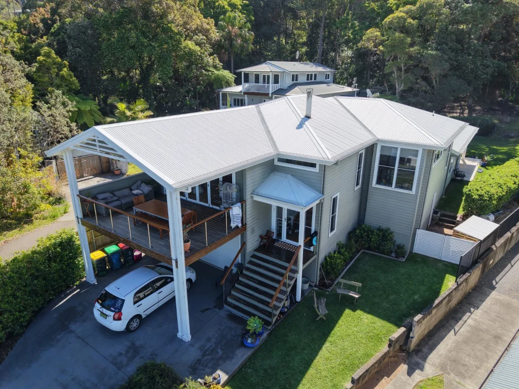 The completed roof wash viewed across the Wombarra home and veranda