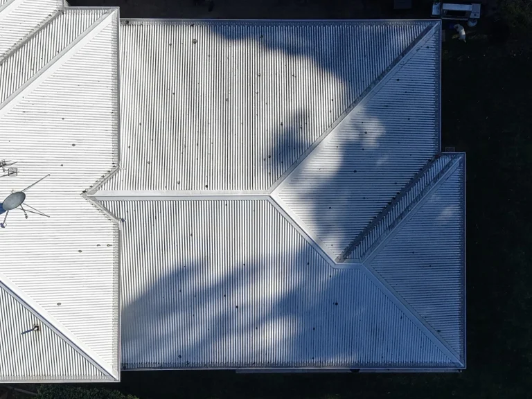 Wombarra roof before washing, viewed from above with surface deposits and tree shadows visible